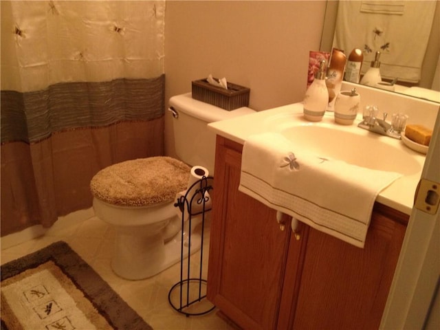 bathroom featuring tile patterned floors, toilet, and vanity