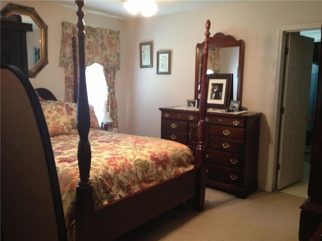 bedroom featuring light carpet