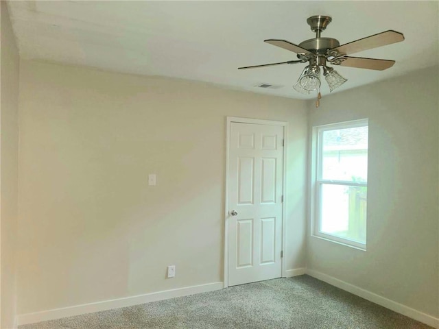 165 Stephens St, Mobile, AL 36606 - spare room with baseboards, light carpet, and a ceiling fan