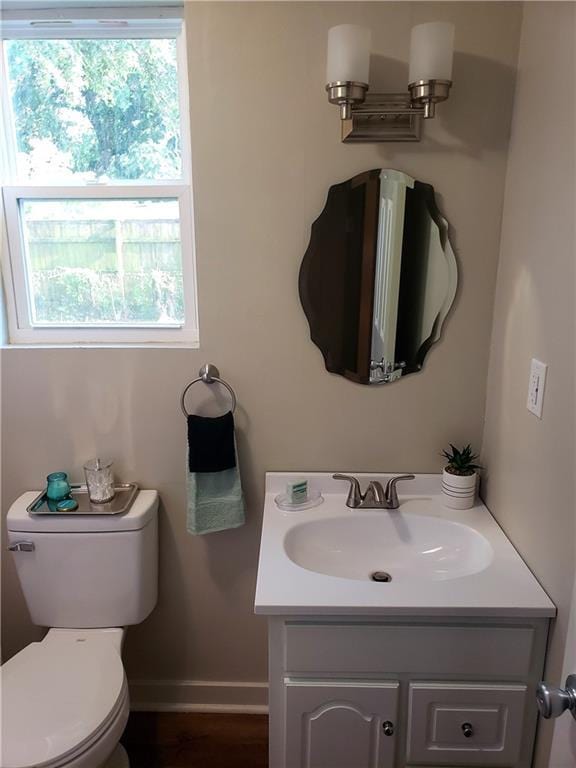 165 Stephens St, Mobile, AL 36606 - half bath with vanity, baseboards, and toilet