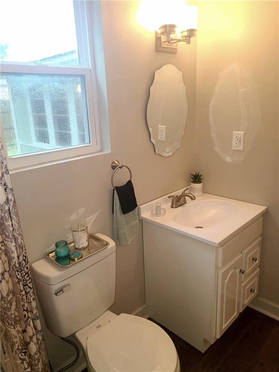 165 Stephens St, Mobile, AL 36606 - bathroom with vanity, toilet, and wood finished floors