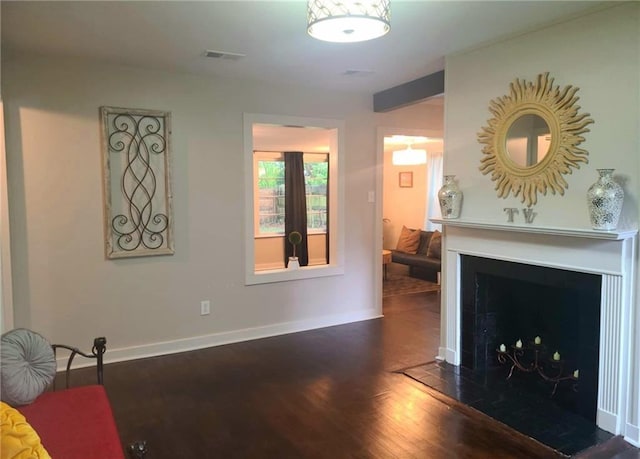 165 Stephens St, Mobile, AL 36606 - living area with wood finished floors, a fireplace with flush hearth, and baseboards