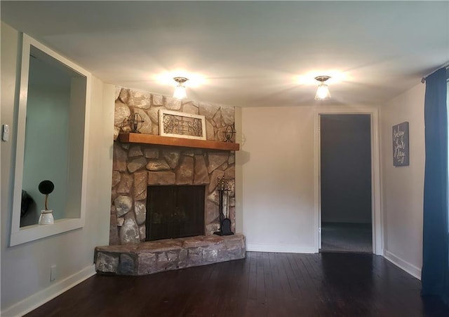 165 Stephens St, Mobile, AL 36606 - living area with baseboards, hardwood / wood-style flooring, and a stone fireplace