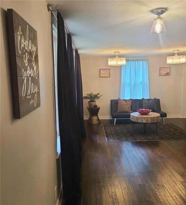 165 Stephens St, Mobile, AL 36606 - living area with a chandelier, hardwood / wood-style floors, and baseboards