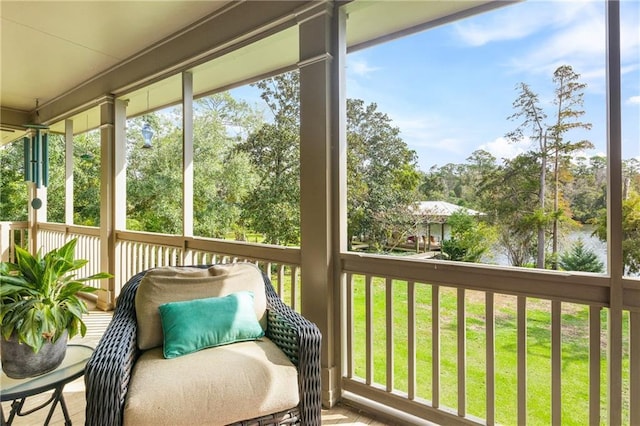 sunroom with a water view