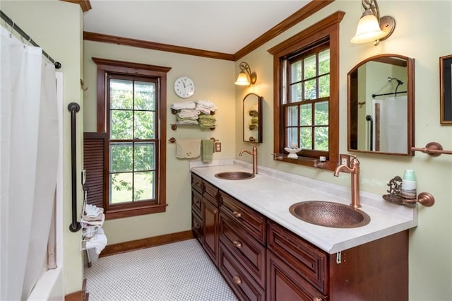 2100 River Forest Rd, Mobile, AL 36605 - full bathroom featuring double vanity, ornamental molding, and baseboards