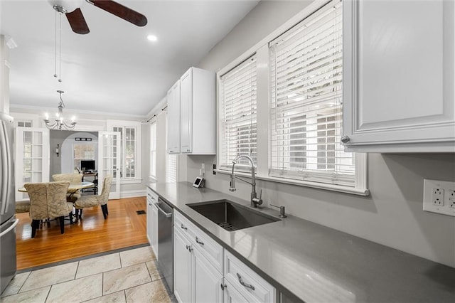 kitchen with white cabinets, sink, and stainless steel appliances