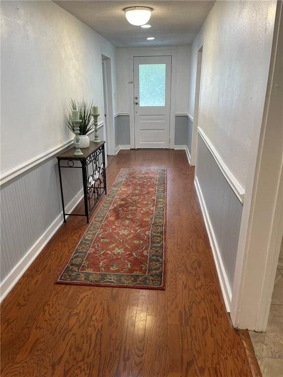 doorway with wood-type flooring