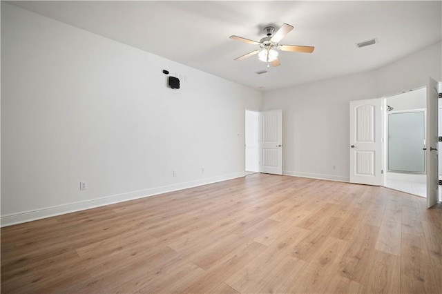 unfurnished room with ceiling fan and light wood-type flooring