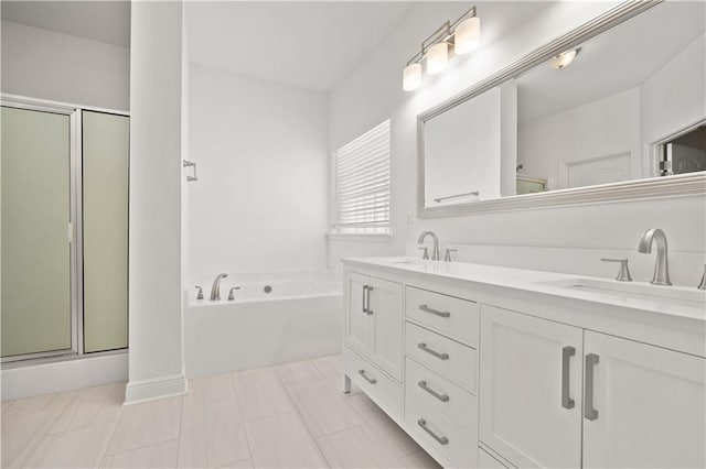 bathroom featuring vanity, ornate columns, and separate shower and tub