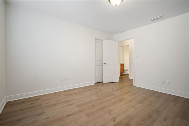 empty room with light wood-type flooring