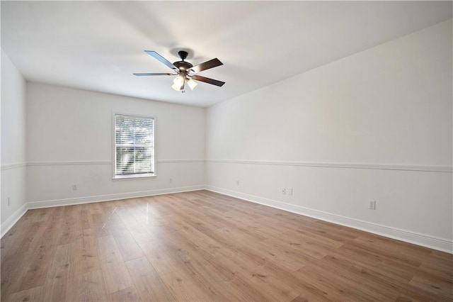 empty room featuring ceiling fan and light hardwood / wood-style flooring