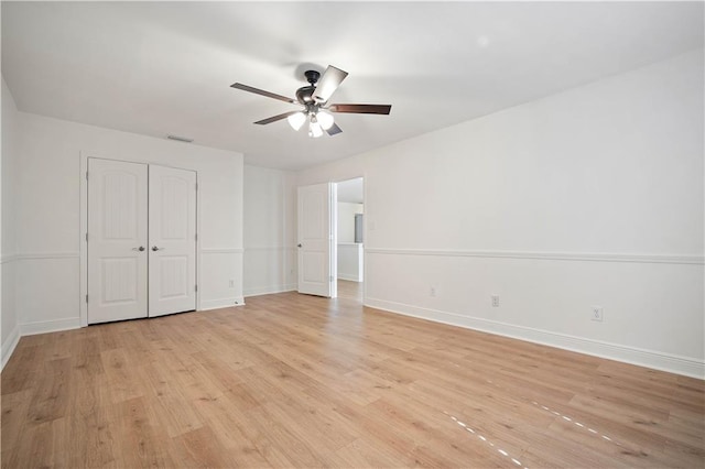 unfurnished bedroom with light hardwood / wood-style floors and ceiling fan