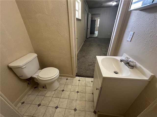 1820 N Barkley Dr, Mobile, AL 36606 - bathroom featuring a textured wall, vanity, healthy amount of natural light, and tile patterned flooring