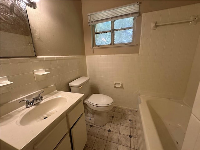 1820 N Barkley Dr, Mobile, AL 36606 - full bath with tile walls, a bathtub, vanity, tile patterned floors, and wainscoting