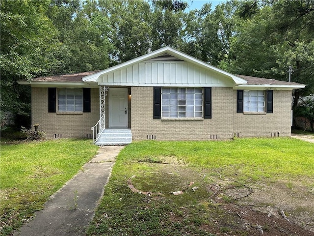1820 N Barkley Dr, Mobile, AL 36606 - view of front of house with crawl space, brick siding, and a front lawn