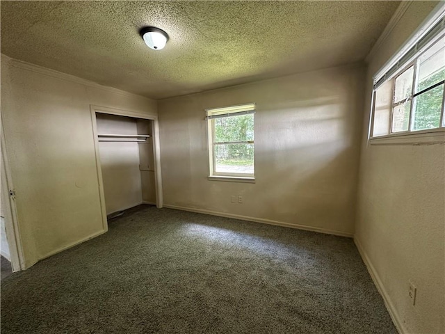 1820 N Barkley Dr, Mobile, AL 36606 - unfurnished bedroom featuring a textured ceiling, carpet flooring, and a closet