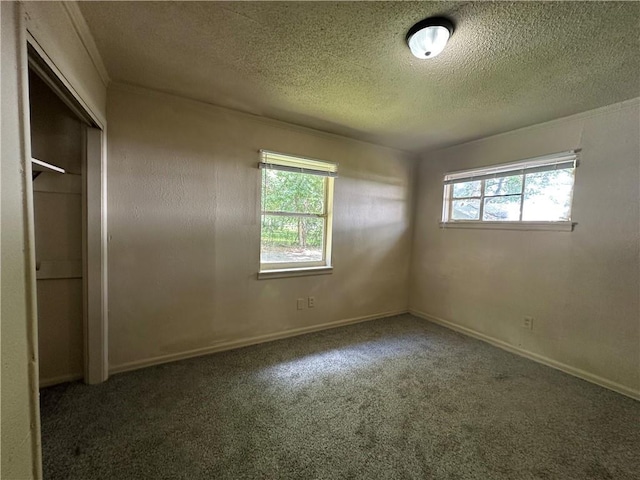 1820 N Barkley Dr, Mobile, AL 36606 - unfurnished bedroom with multiple windows, a textured ceiling, carpet, and a closet