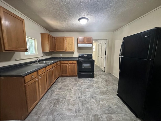 1820 N Barkley Dr, Mobile, AL 36606 - kitchen featuring black appliances, brown cabinetry, under cabinet range hood, a textured ceiling, and dark countertops