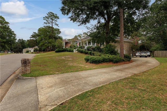 1337 Carson Rd W, Mobile, AL 36695 - obstructed view of property featuring a front yard and driveway