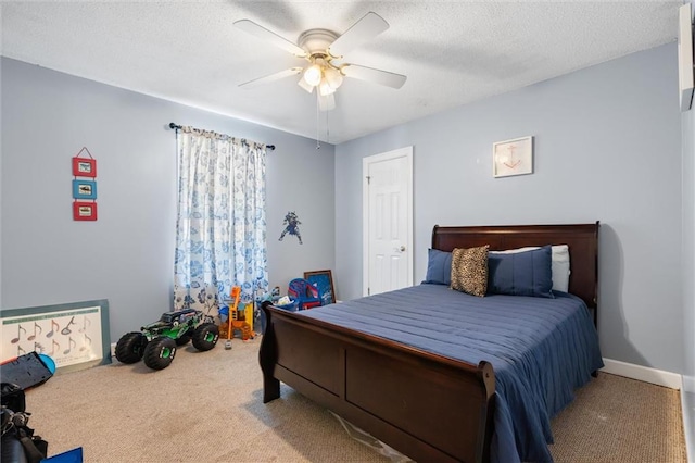 carpeted bedroom with a textured ceiling and ceiling fan