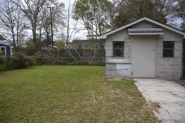 view of outbuilding with fence