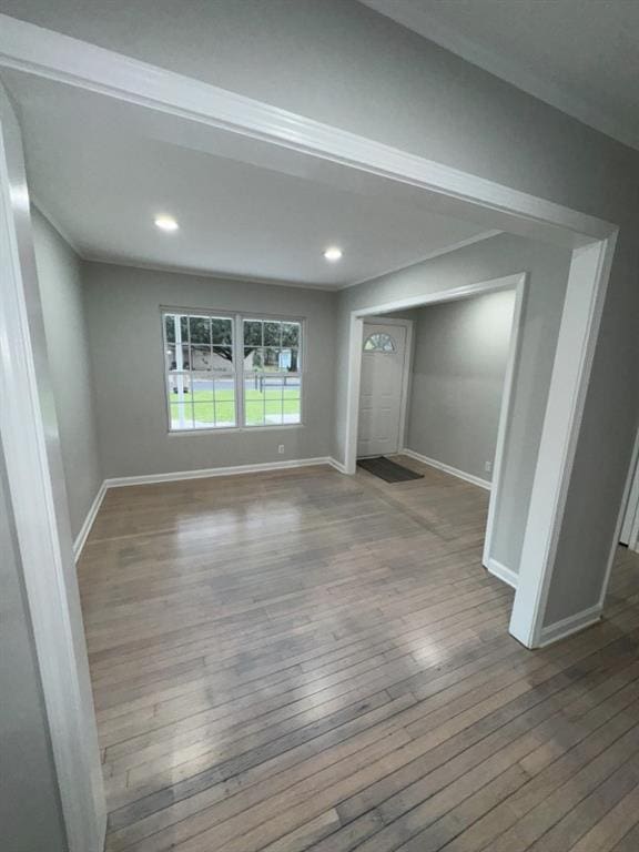 unfurnished living room with recessed lighting, baseboards, and hardwood / wood-style flooring