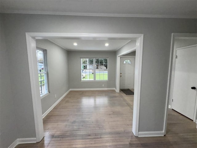 interior space featuring recessed lighting, baseboards, and hardwood / wood-style floors