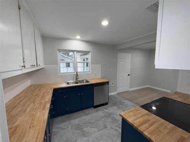 kitchen with a sink, white cabinets, dishwasher, blue cabinets, and butcher block counters