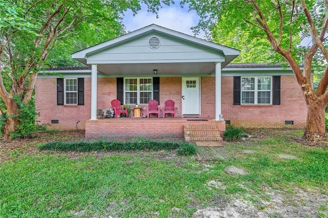 14371 Joe Hamilton Rd, Grand Bay, AL 36541 - view of front facade featuring crawl space, a porch, brick siding, and a front yard
