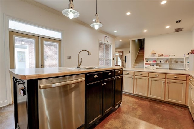 kitchen featuring sink, dishwasher, a wealth of natural light, pendant lighting, and a kitchen island with sink