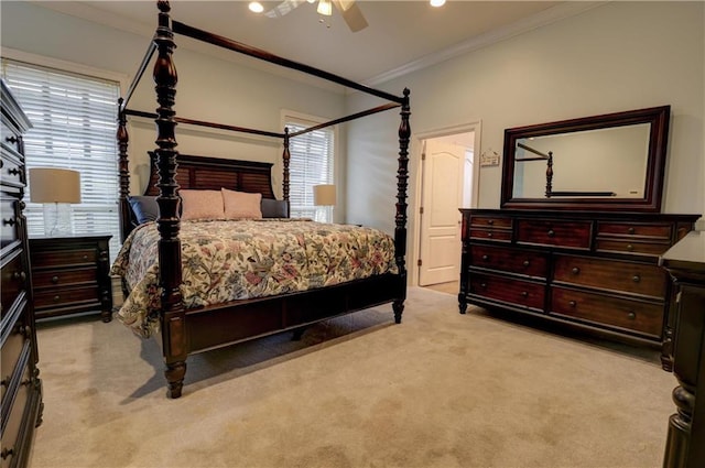 bedroom featuring ornamental molding, light colored carpet, and ceiling fan