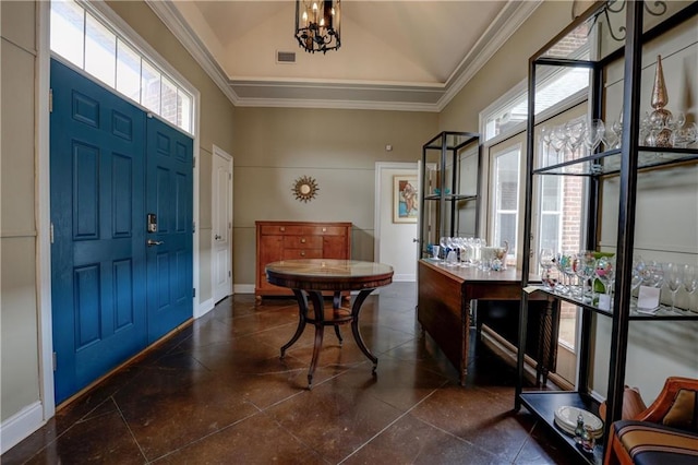 foyer entrance featuring crown molding, vaulted ceiling, and a notable chandelier