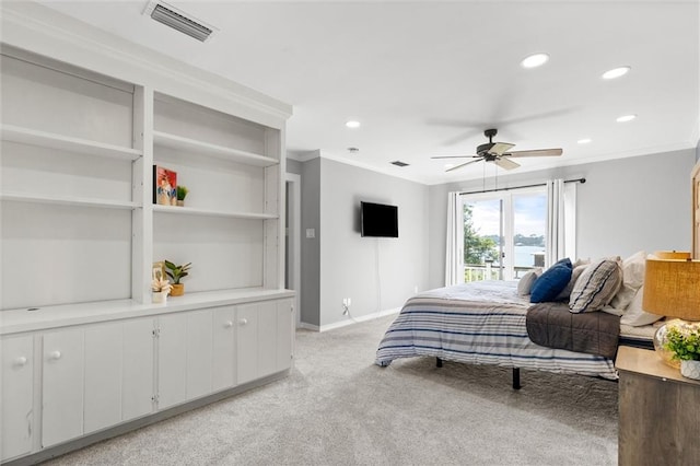 carpeted bedroom featuring ornamental molding and ceiling fan