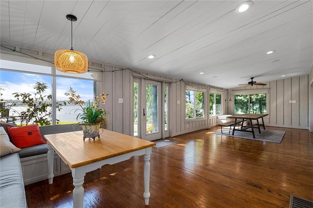 dining area featuring ceiling fan and dark hardwood / wood-style flooring