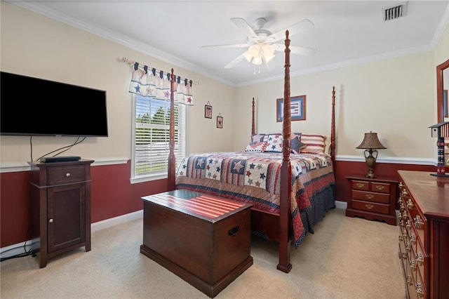 bedroom featuring light carpet, ceiling fan, and crown molding