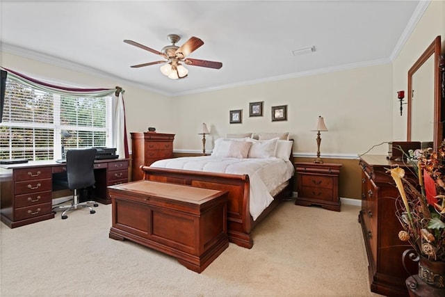 carpeted bedroom featuring crown molding and ceiling fan