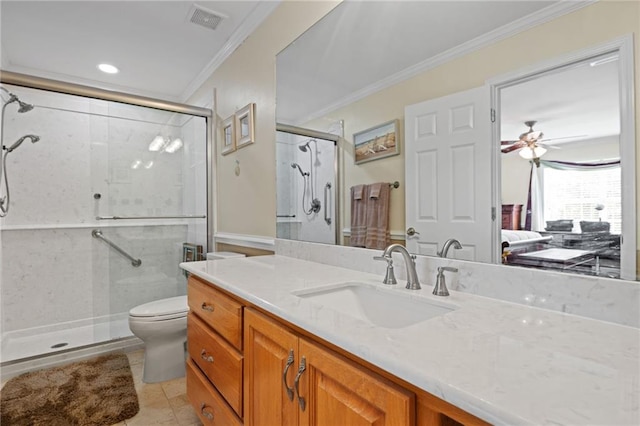 bathroom with a shower with door, vanity, toilet, ornamental molding, and ceiling fan