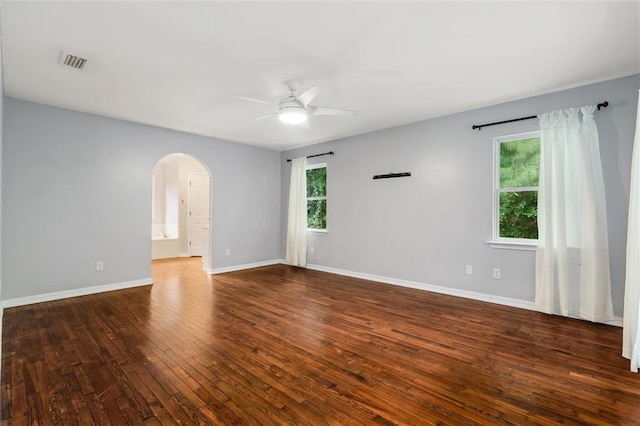 spare room with ceiling fan and dark hardwood / wood-style floors