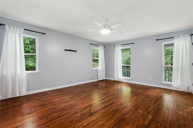 unfurnished room with ceiling fan and dark hardwood / wood-style floors