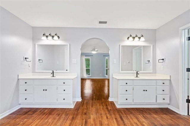 bathroom featuring vanity, wood-type flooring, and ceiling fan