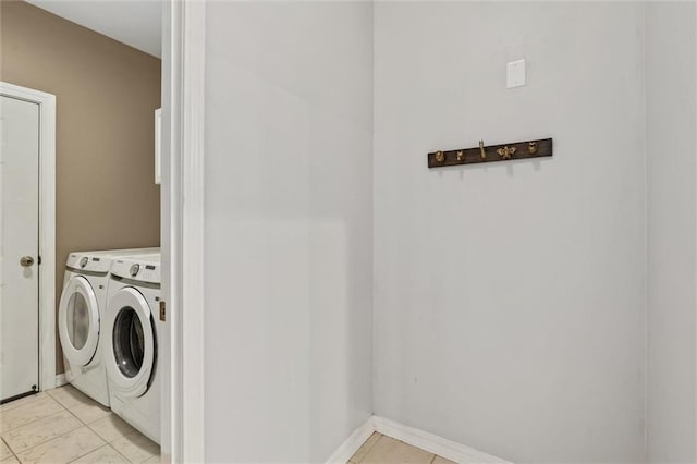 laundry area with washing machine and clothes dryer