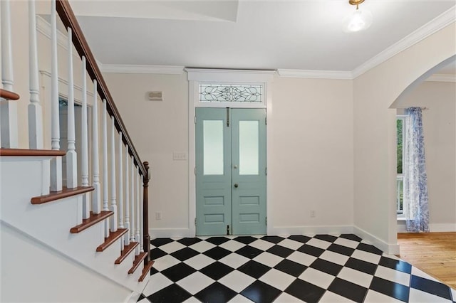 entrance foyer with crown molding and light hardwood / wood-style flooring