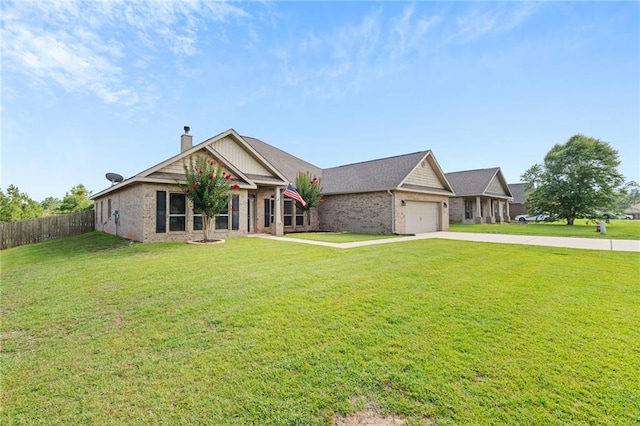 13077 Tara Point Dr, Mobile, AL 36695 - view of front of house with concrete driveway, a garage, brick siding, and a chimney