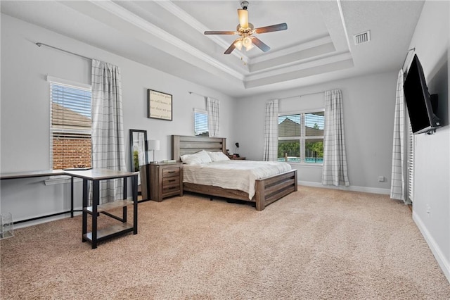 13077 Tara Point Dr, Mobile, AL 36695 - carpeted bedroom featuring a tray ceiling, baseboards, and crown molding