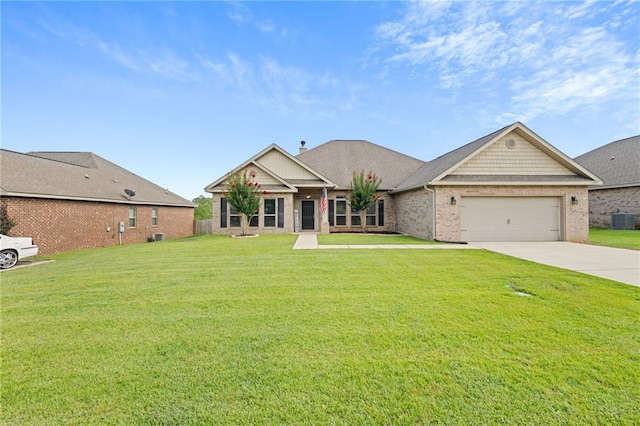 13077 Tara Point Dr, Mobile, AL 36695 - craftsman house with an attached garage, central AC, concrete driveway, and a front lawn