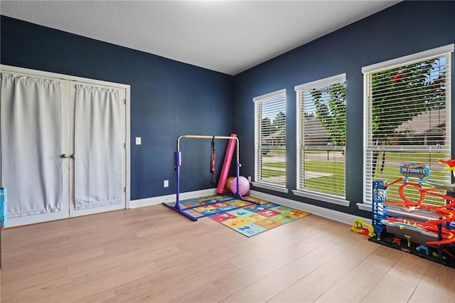 13077 Tara Point Dr, Mobile, AL 36695 - recreation room featuring wood finished floors and baseboards