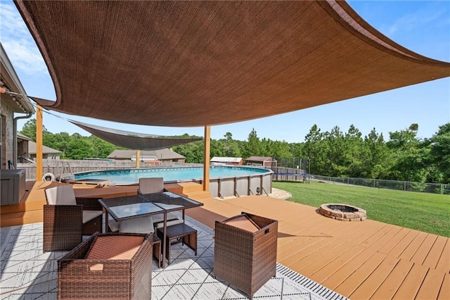 13077 Tara Point Dr, Mobile, AL 36695 - deck featuring a trampoline and a fire pit