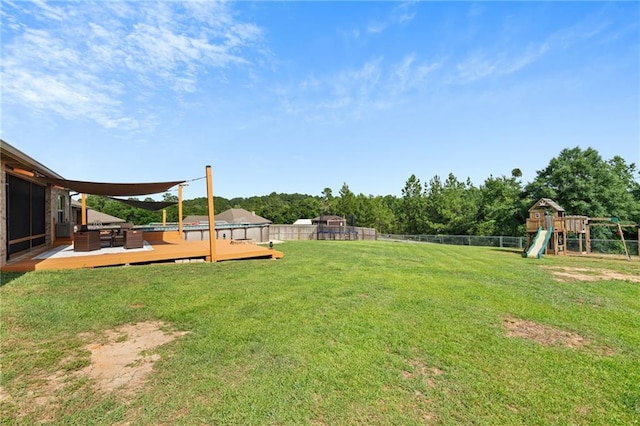 13077 Tara Point Dr, Mobile, AL 36695 - view of yard with a wooden deck and a playground