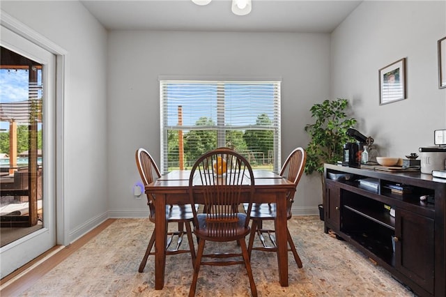 13077 Tara Point Dr, Mobile, AL 36695 - dining area featuring plenty of natural light, light wood-type flooring, and baseboards